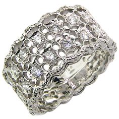 The Stefania collection is all grace and delicacy, and this wide band is an excellent example. Two rows of beautiful diamonds are held in an all white scalloped setting, entirely hand-fabricated and hand-engraved. This wide diamond band has great scale but retains visual delicacy due to the light and airy style. This ring is low-profile and tapered. As with all our Florentine engraved jewels, Stefania is hand-crafted and hand-engraved by master goldsmiths in a multi-generation, family-owned atel Wide Diamond Bands, Wide Ring, Wide Rings, Men Diamond Ring, Florence Italy, Diamond Band, Eternity Band, Wide Bands, Hand Engraving