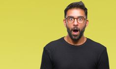 a man with glasses making a surprised face