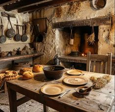 an old fashioned kitchen with bread on the table