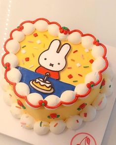 there is a cake decorated with an image of a rabbit on it