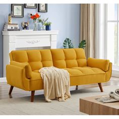 a living room scene with focus on the yellow couch and white table in the background