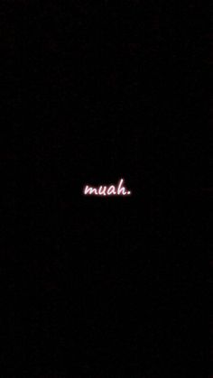 the word muah is lit up in the dark