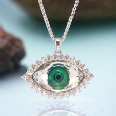 Beautiful mystic green crystal eye surrounded with clear zircons. Dainty silver chain is added. Made of hypoallergenic jewelry alloy. Length of the necklace: 15,74 inches + 1,96 inches additional chain / 40 cm + 5 cm additional chain. Choose the eye color in Options. Green Evil Eye, Goth Choker, Crystal Green, Wiccan Jewelry, Crystal Eye, Hypoallergenic Jewelry, Fire Heart, Green Crystal, Evil Eye Necklace