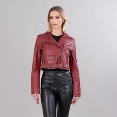 Burgundy short leather jacket.  This short jacket has zipped exterior side pockets, a collar, a belt, and also a zipper closure.  The garment will stand out with its unique pattern and warmth.  The jacket manufactures in our company in Greece with high-quality lambskin. Leather: Lamb Color: Red Length: 45-50 cm (17,7-19,6 in) Collar: Yes Exterior pockets: Yes Belt: Yes Lining: 100% Polyester Care: Specialist clean Fall Cropped Belted Jacket, Cropped Leather Biker Jacket With Zipper, Edgy Fitted Belted Leather Jacket, Belted Moto Biker Jacket For Fall, Leather Cropped Jacket With Zipper Closure, Edgy Leather Cropped Jacket With Long Sleeves, Spring Leather Biker Cropped Jacket, Spring Biker Cropped Leather Jacket, Fall Biker Jacket With Belt