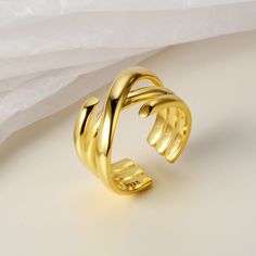 This Multi-Layer Wrap Around Crossed Band Ring is the perfect accessory to make a bold statement. With its sophisticated design, this ring is made from durable materials to provide a secure and comfortable fit. A stylish ring made with fashion in mind. Product Details Material: 925 Silver Color: 18K Gold/White Gold Plated Size: US Opening size 6.25 (adjustable size 5.5-7.5) Weight: about 7-7.2g SKU: AR23100720-G/AR23100720-W Product Keywords: Distorted band rings, Avante-garde rings, Unique shap Trendy Gold Open Band Rings, Modern Twist Gold Metal Rings, Gold Wide Band Open Ring, Gold Rings With Modern Twist And Wide Band, Gold Wide Band Ring With Modern Twist, Vintage Gold Rings, Rings Unique, Blood Diamond, Ringe Gold