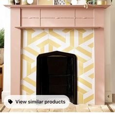 a pink fireplace with yellow and white tiles on the mantel above it is an image of a black fire place