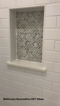 a white tiled bathroom with a window in the wall