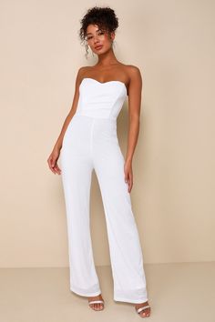 Make the streets your runway for the evening in the Lulus Fashionista Nights White Sequin Strapless Wide-Leg Jumpsuit! This bustier-inspired jumpsuit features a mesh knit overlay, embellished with dazzling white sequins throughout. Strapless, sweetheart neckline (with hidden no-slip strips) tops a princess-seamed bodice with supportive boning and pleated detailing. High, fitted waist sits atop wide pant legs that end at ankle-length hems. Sheer mesh at the back features decorative corset-inspire Strapless Fitted Jumpsuits For Party, Strapless Fitted Jumpsuits And Rompers For Party, Glamorous Fitted Strapless Jumpsuit For Prom, Glamorous Strapless Jumpsuit For Prom, Evening Stretch Strapless Jumpsuits And Rompers, Glamorous Strapless Jumpsuits And Rompers For Party, Glamorous Strapless Party Jumpsuits And Rompers, Fitted Strapless Jumpsuit For Night Out, Strapless Fitted Jumpsuit For Night Out