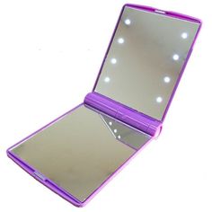 an open purple mirror with lights on it