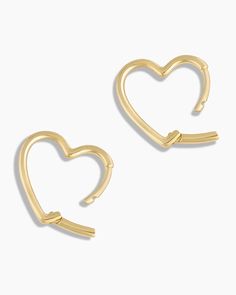 These 14k solid gold hoop earrings feel extra romantic thanks to their playful heart shape. Wear this in your first piercing and pair it with dainty diamond stud earrings. Open Heart Huggies Earring in 14k Solid Gold, Women's by gorjana Elegant Everyday Huggie Earrings For Valentine's Day, Elegant Valentine's Day Huggie Earrings, Heart-shaped Yellow Gold Hoop Earrings For Everyday, Yellow Gold Heart Hoop Earrings For Everyday, Everyday Heart-shaped Hoop Earrings In Yellow Gold, Everyday Heart-shaped Yellow Gold Hoop Earrings, Valentine's Day Huggie Heart Earrings, Valentine's Day Yellow Gold Huggie Jewelry, Heart-shaped 14k Gold Huggie Earrings For Valentine's Day