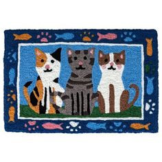 a door mat with three cats on it