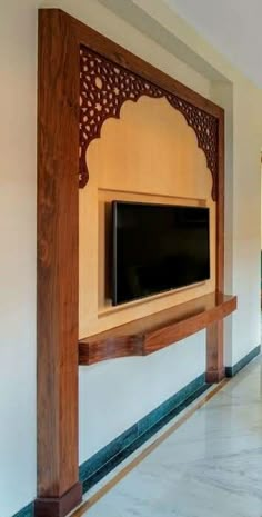 a flat screen tv mounted to the side of a wall