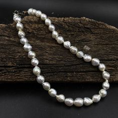 White Baroque Pearl Necklace , South Sea Pearl Necklace , Saltwater Pearl Beads , White Keshi Pearl , Unshaped Baroque Pearl , Pearl Jewelry SPECIFICATIONS ♦ Pearl Type: 100% Genuine Flawless Cultured South Sea Pearls. ♦ Pearl: Shape: Perfectly Rounded ♦ Necklace Length : 17-18 inches. ♦ Pearl Diameter: 9.0 to 10.0 mm ♦ Weight : 252 CTS ♦ Pearl Color: White with Bright Silver Hues .The shimmer, the luster is like a mirror. There are only few of them around and i wonder who is the lucky lady whos going to adorn them?! ♥ ♦ Pearl Luster: Excellent, bright and sharp ♦ Nacre Quality: Thick, no noticeable nucleus, not chalky ♦ Pearl Surface: Clean with no visible irregularities (Near Clean to Clean) ♦ Pearl Matching: Excellent (uniform appearance) Pearls Harmoniously Matched. It took me a long t Pearl Drop Beaded Necklaces With Round Beads, White Single Strand Pearl Necklace With Oval Beads, White Oval Beads Single Strand Pearl Necklace, Round Pearl Necklace With Large Beads For Jewelry Making, Pearl White Necklace With Large Round Beads, Pearl Necklace With Large Beads As Gift, Pearl Necklace With Large Beads For Gift, Large Beads Pearl Necklace As Gift, White Pearl Necklace With Polished Round Beads