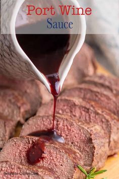 red wine sauce being poured onto sliced meat