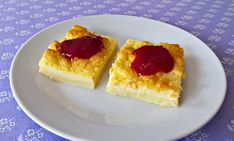 two pieces of cake on a white plate