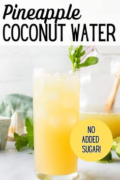 a pineapple coconut water in a glass next to another drink