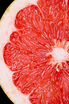 the grapefruit is cut in half and ready to be eaten