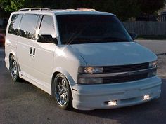 a white van parked in a parking lot