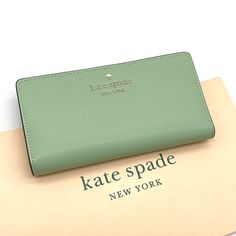 Brand New With Tag Kate Spade Staci Large Slim Bifold Wallet Color: Beach Glass Details Saffiano Leather Two Way Spade Jacquard Lining Snap Closure 12 Credit Card Slots Id Window 4 Slip Pockets Zip Compartment On Back Of Wallet Approx. Measurements: 3.5"H X 6.7 W Elegant Green Wallets With Card Slots, Green Leather Evening Wallets, Elegant Green Wallets For Travel, Elegant Green Bifold Wallet, Kate Spade Everyday Bifold Bag, Chic Green Wallet For Daily Use, Chic Kate Spade Bifold Wallet, Elegant Green Clutch Wallet, Chic Kate Spade Wallets With Interior Card Slots