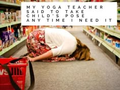 a woman kneeling down on the floor in a grocery store with her hand over her face