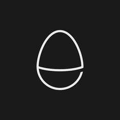 an egg is shown in the middle of a black and white photo, with a thin line around it