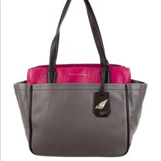 Diane Von Furstenberg On-The-Go Leather Tote Bag. Grey And Fuschia Leather Diane Von Furstenberg On-The-Go Tote With Gold-Tone Hardware, Dual Flat Shoulder Straps, Four Exterior Pockets, Foil-Stamped Logo Accent At Front, Black Jacquard Lining, Four Pockets At Interior Walls; One With Zip Closure And Concealed Magnetic Closure At Top. Includes Dust Bag. Height: 11" Depth: 7" Width: 18" Shoulder Strap Drop: 8" Dvf Handbags, Garden Tote, Interior Walls, Leather Tote Bag, Von Furstenberg, Diane Von, Diane Von Furstenberg, Magnetic Closure, Womens Tote Bags