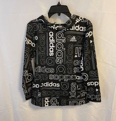 Adidas Girls Hoodie Pullover Lightweight Black Size Large 14  100% Polyester  New with tags measures approx arm pit to arm pit 17'' shoulder to hem 22 1/2'' Smoke Free/Pet Free Home Adidas Hooded Athleisure Top, Adidas Athleisure Hooded Top, Adidas Stretch Long Sleeve Tops, Adidas Black Hoodie For Spring, Adidas Long Sleeve Athleisure Tops, Black Hooded Top With Logo Print, Adidas Hoodie For Fall, Adidas Tops With Graphic Print For Fall, Adidas Long Sleeve Top With Logo Print