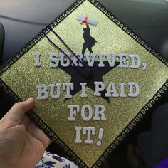 a graduation cap that says i survived but i paid for it