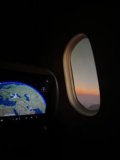 an airplane window looking out at the earth