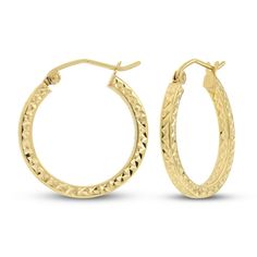 These beautiful hoop earrings for her are crafted in iconic 14K yellow gold and showcase a beautiful diamond cut finish. The textured hoops measure 20mm and secure with snap-lock clasps. Anniversary Yellow Gold Hinged Hoop Earrings, 14k Yellow Gold Diamond Cut Hoop Earrings, Engraved 14k Yellow Gold Hoop Earrings, 14k Gold Hinged Huggie Hoop Earrings, 14k Gold Diamond Cut Hoop Earrings For Anniversary, Small Hoop Earrings In Yellow Gold With Diamond Cut, Small Diamond Cut Yellow Gold Hoop Earrings, 14k Gold Huggie Earrings With Diamond Cut, Small Yellow Gold Hoop Earrings With Diamond Cut