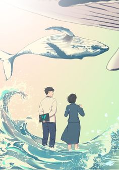 two people looking at a whale in the ocean