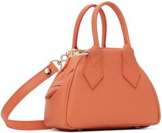 Saffiano faux-leather top handle bag in orange. · Rolled carry handles · Adjustable and detachable crossbody strap · Logo hardware at face · Bumper studs at base · Zip closure · Card slot at interior · Twill lining · Logo-engraved gold-tone hardware · H4.5 x W6.5 x D3 Supplier color: Orange Vivienne Westwood Logo, Faux Leather Top, The Vivienne, Chain Bags, Vivienne Westwood, Leather Top, Crossbody Strap, Travel Luggage, Luggage Bags