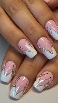 a woman's hand with some pink and white nails