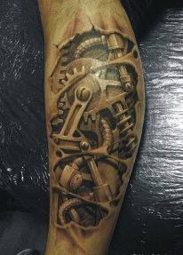 a man's arm with a clock and gears tattoo on it