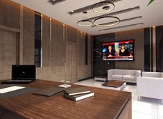 a living room with couches, tables and a flat screen tv on the wall