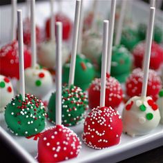 there are many desserts with white and red frosting on the cake pops together