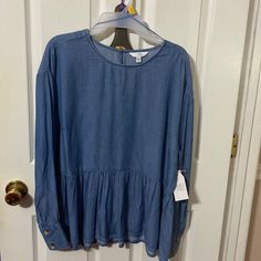 Time And Tru Women’s Long Sleeve Crinkle Peplum Top With One Button Closure On The Back; Two Button Closure At Bottom Of Sleeve; 100% Lyocell; Color: Medium Wash Blue; Size: Large(12-14) Casual Blouse With Ruffle Hem, Fitted Blue Wrinkle-resistant Shirt, Cotton Wrinkle-resistant Button-up Top, Blue Long Sleeve Wrinkle-resistant Shirt, Blue Tencel Button-up Top, Blue Stretch Top With 3/4 Sleeves, Black Short Sleeve Shirt, Flowy Blouse, Denim Blouse