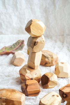 wooden blocks and pieces of wood on a white cloth