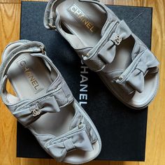 Beautiful Grey Leather Chanel Dad Sandals With The Iconic Cc Logo. Extremely Difficult To Find. Never Worn. Original Dust Bags And Box. Size: 37 Eu (Fits Like A Us 7.5-8) Luxury Flat Platform Sandals, Designer Flat Heel Platform Sandals, Designer Summer Sandals With Cushioned Footbed, Designer Cushioned Sandals For Summer, Luxury Cushioned Sandals For Summer, Designer Round Toe Sandals For Summer, Luxury Round Toe Sandals For Summer, Designer Beige Platform Sandals, Luxury Flat Heel Platform Sandals