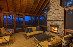 a living room filled with furniture and a fire place