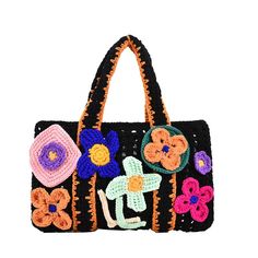 a crocheted handbag with flowers on it