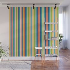 a colorful striped wallpaper in a living room