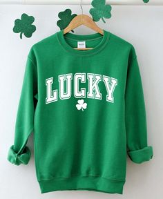 Lucky Sweatshirt Cute St. Patricks Day Sweatshirt,St Patricks,Trendy St Patricks Day Crewneck,St Paddy's Day, Irish Sweatshirt,Cute Lucky   We design trendy sweatshirts that you can use in every important day of your life. We produce beautiful and quality designs that can be used in all kinds of activities that you will do with your family or friends. These designs will offer you and your environment a unique complement. We are very excited to bring you our high quality and soft, trendy sweatshi Shamrock Sweater, Trendy Sweatshirts, St Paddys Day, Sweatshirt For Women, Sweater For Women, Sweatshirt Cute, Saint Patrick, Women Shirt, Trendy Tshirts