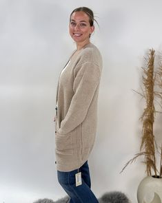 Available in 4 beautiful colors, this super comfy chenille cardi has pockets and a button front closure, and is long enough to cover your bum. Don't wait to get your hands on one! Materials: 100% Polyester Microfiber Sizes: One Size - Robyn is 5'3" on a good day, and typically wears size Medium. Care: Machine Wash - Cold, Do Not Bleach, Lay Flat To Dry/Tumble Dry Cozy Button-up Cardigan For Loungewear, Cozy Button-up Sweater Coat, Beige Button-up Cardigan For Loungewear, Comfy Everyday Cardigan, Capri Set, Bamboo Pajamas, Linen Shop, V Neck Cardigan, Girl Day