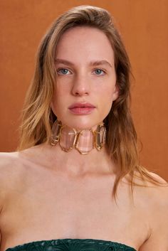 A statement choker crafted from octagonal clear gems encased in gold-toned prongs with a gold-toned chain and clasp. — Octagonal clear gems — Gold toned hardware — Adjustable clasp Statement Choker, Cult Gaia, Choker, Gold Tones, Gems, Chain, Gold