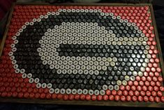 there is a large bottle cap art made to look like a man's face