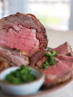 a close up of a plate of food with broccoli and meat on it