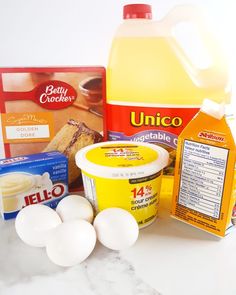 eggs, butter, and other ingredients are sitting on a counter top next to each other