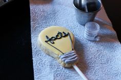 a cookie shaped like a hot air balloon sitting on top of a white table cloth