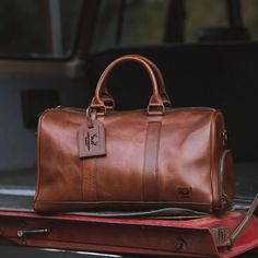 Discover the perfect blend of style and functionality with our Luxurious Leather Duffle Bag. Crafted with precision, this travel bag showcases the timeless elegance of woven leather, offering a sleek and sophisticated silhouette that's perfect for the modern man. Whether you're planning a weekend getaway to the river or a scenic trip to wine country, this bag is your ideal companion. The spacious interior ensures you have ample room for all your essentials, and the dedicated side compartment for Grunge Bags, Leather Duffle Bag Men, Buffalo Jackson, Mens Duffle Bag, Mens Bag, Leather Duffel Bag, Leather Duffel, Mens Travel, Sac Week End